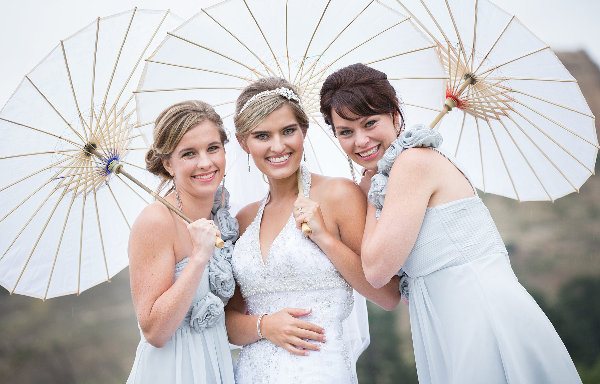bridemaids under umbrella